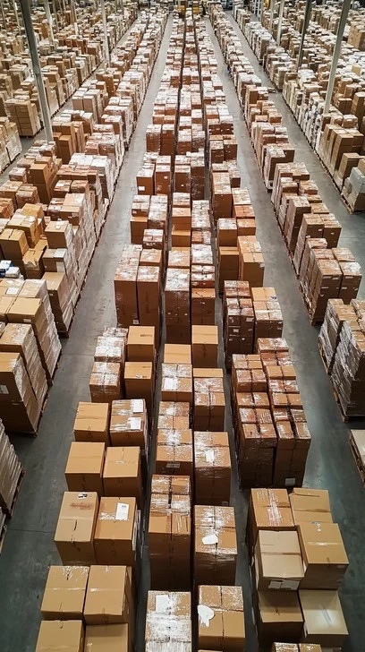 Massive warehouse with rows of boxed Christmas light supplies